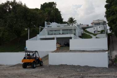 Modern white villa with balconies hillside garden coastal view Costa Esmeralda Panama