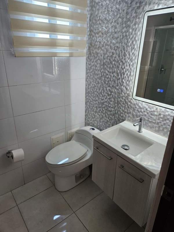 Contemporary bathroom with LED mirror and wall-mounted vanity in PH Miro El Cangrejo Panama