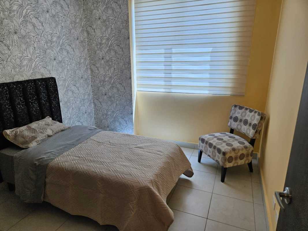 Contemporary bedroom with floral wallpaper and blinds PH Miro El Cangrejo Panama