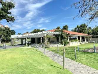 Bright living area leading to balcony with nature views in VistaMar San Carlos Panama