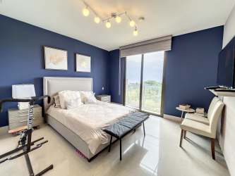 Bright living and dining area with ocean views inside PH CasaMar condo Panama