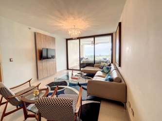 Infinity swimming pool surrounded by palm trees and gardens at CasaMar San Carlos Panama