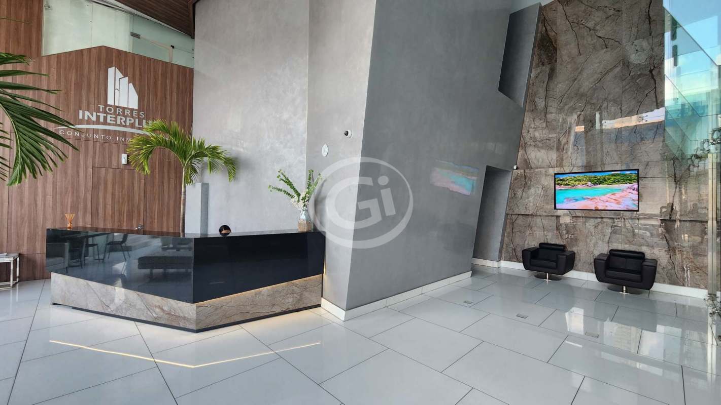 Lobby area with marble accent wall, reception counter, modern seating at PH Balboa Office Center