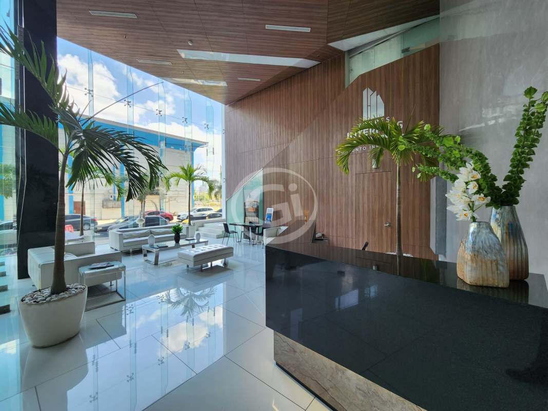 Contemporary lobby with glass wall, sofas, indoor plants and reception desk PH Balboa Office Center