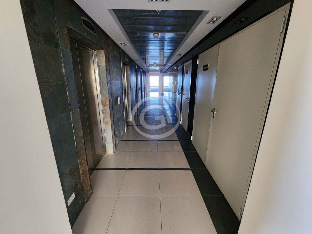 Stylish reception lobby with glass walls, modern decor, sofas and plants PH Balboa Office Center