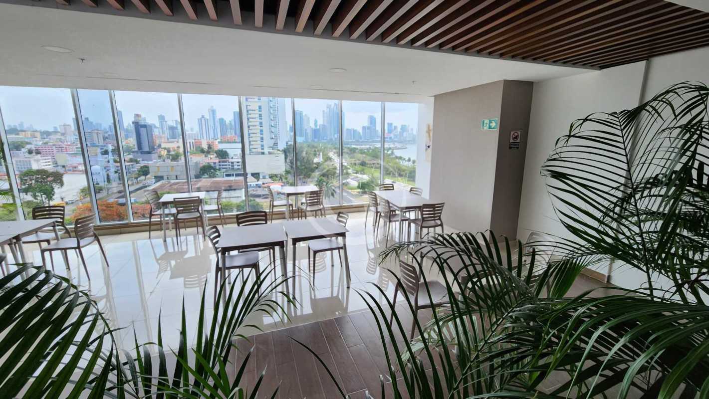 Modern elevator corridor with stone tile walls and lighting PH Balboa Office Center Panama