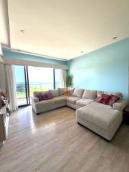 Twin beds second bedroom with blackout curtains AC Punta Caelo beachfront apartment San Carlos