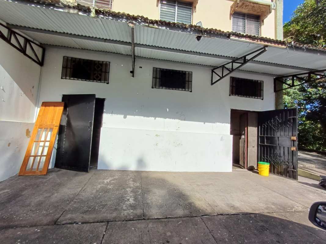 Unfinished commercial interior with open wall-mounted cabinets and tiled floor at PH Edificio Tuira Panama