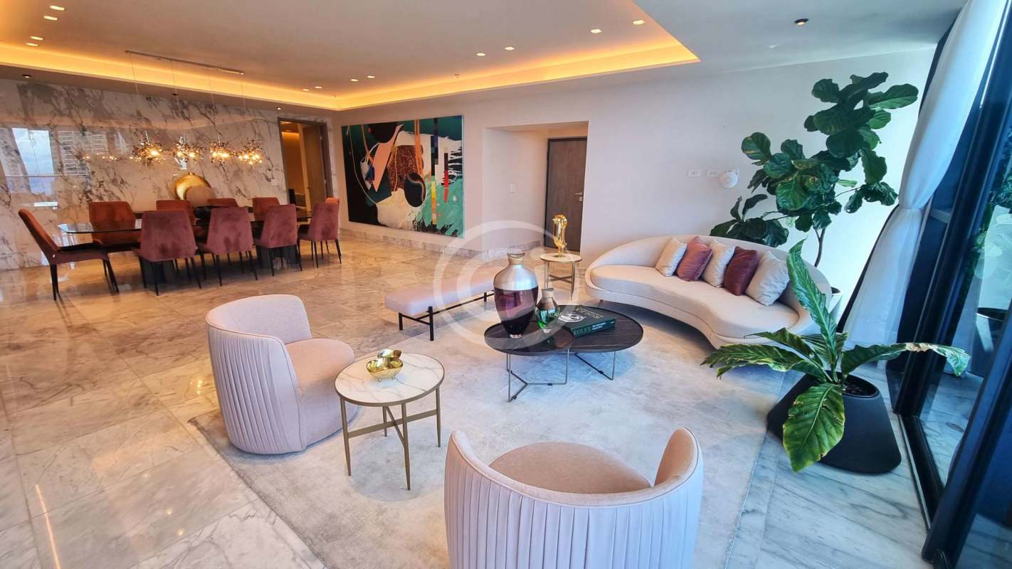 Spacious living room with marble floors, large windows, city and ocean views in luxury penthouse Punta Paitilla