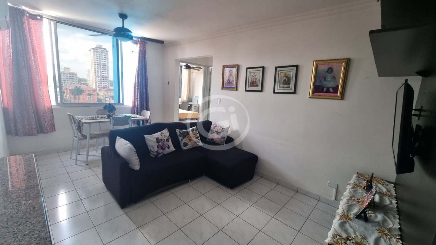 Bright living and dining area with large window, sectional sofa, ceiling fan in PH Torres Bella Vista Panama