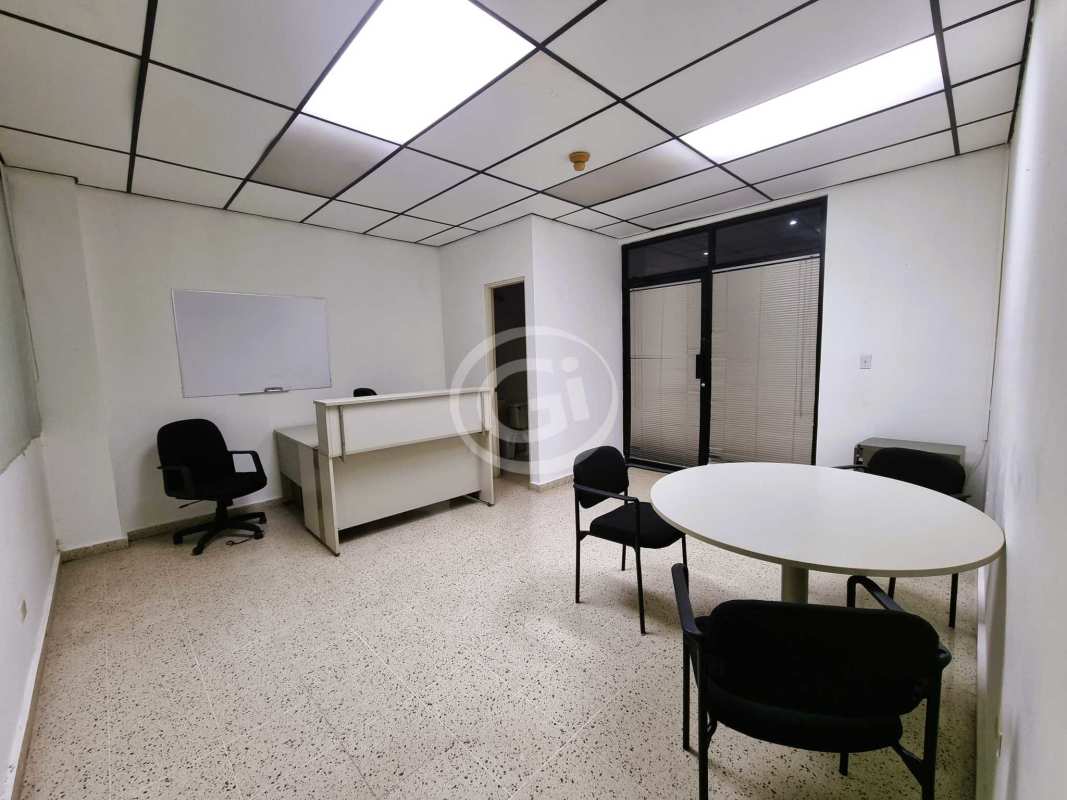 Workspace with white desks chairs AC windows PH BICSA Tower Panama City