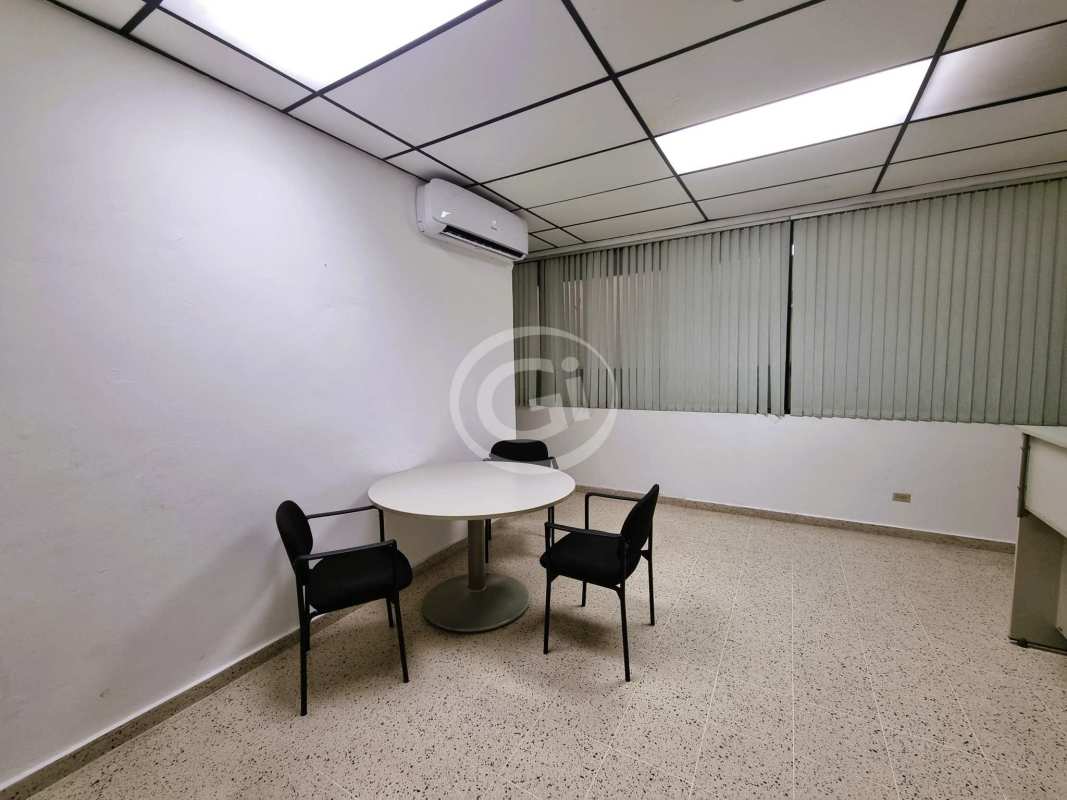 Small meeting table with chairs in furnished office PH BICSA Tower Panama City