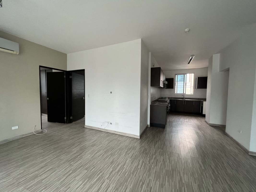 Empty bedroom with large window and built-in closet city skyline view PH Galeria Uno