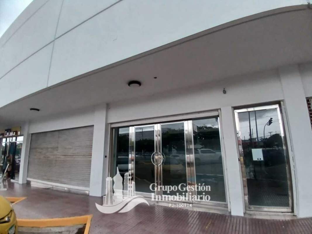 Streetfront commercial space exterior glass facade with security shutters at Dorado Plaza Panama City