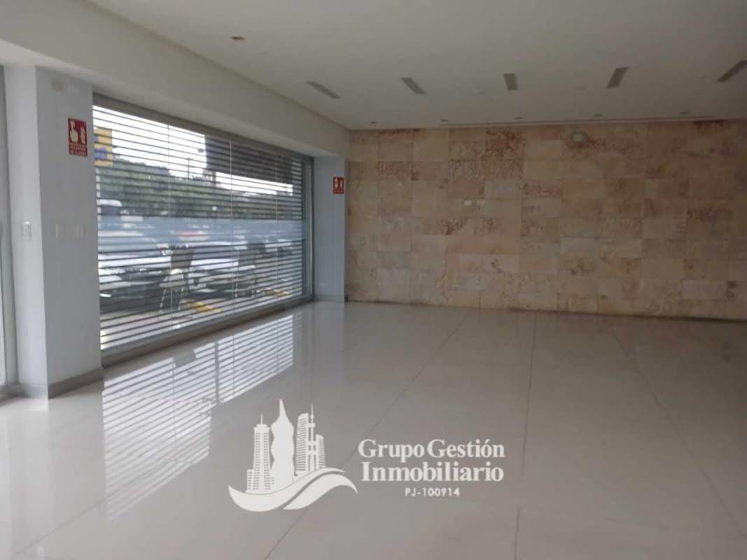Modern commercial interior with tiled floors and wide open layout at Dorado Plaza Panama City