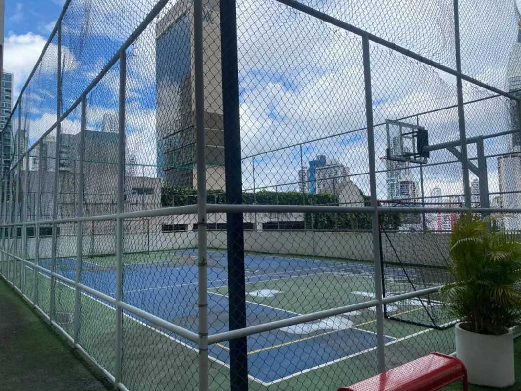 Modern open-plan living and dining with ocean views opening to balcony PH BICSA Panama City