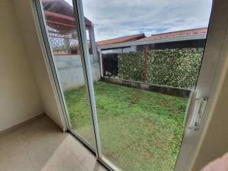 Bright family living space opens to garden with ceramic floors Los Avellanos Panama