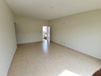 Bedroom with large window, tiled floors, neutral paint in Costa Verde La Chorrera