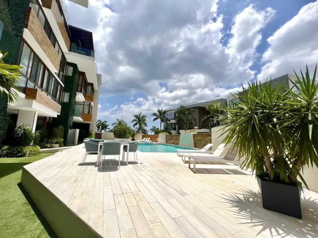 Contemporary kitchen with white cabinetry, island cooktop and marine views at PH Garden Ocean Reef Islands Punta Pacifica