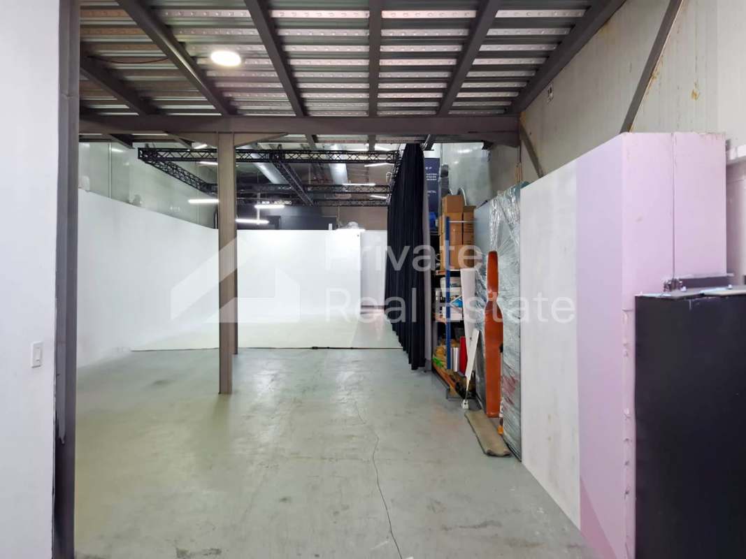 Large open industrial studio with cyclorama wall, black curtains and mezzanine office commercial Panama Coco del Mar