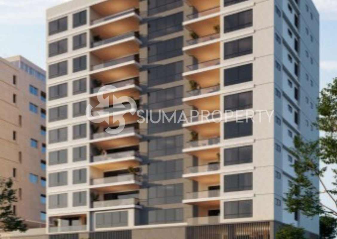 Spacious kitchen with large island, built-in appliances and natural light