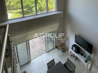 Loft apartment open living dining space floor to ceiling windows Buenaventura Panama