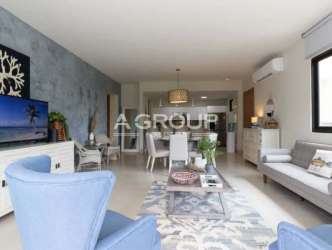 Bright guest bedroom with large window in Casamar beach apartment