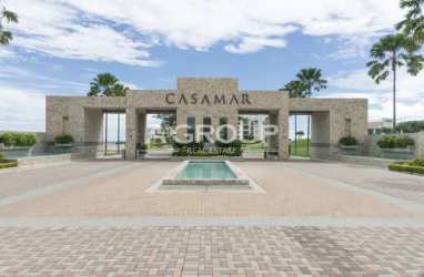 Kitchen with granite countertops, breakfast bar, stainless appliances in Casamar beach condo
