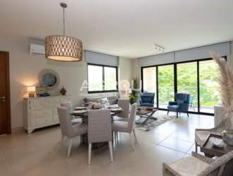 Bright bedroom featuring balcony access, AC, and ocean view in Casamar San Carlos