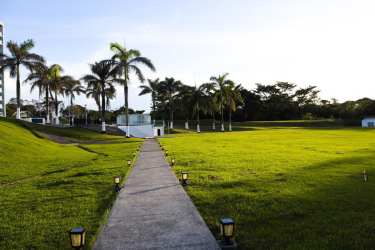 Master bedroom furnished with AC, closet, and balcony sea views at Bala Beach Resort