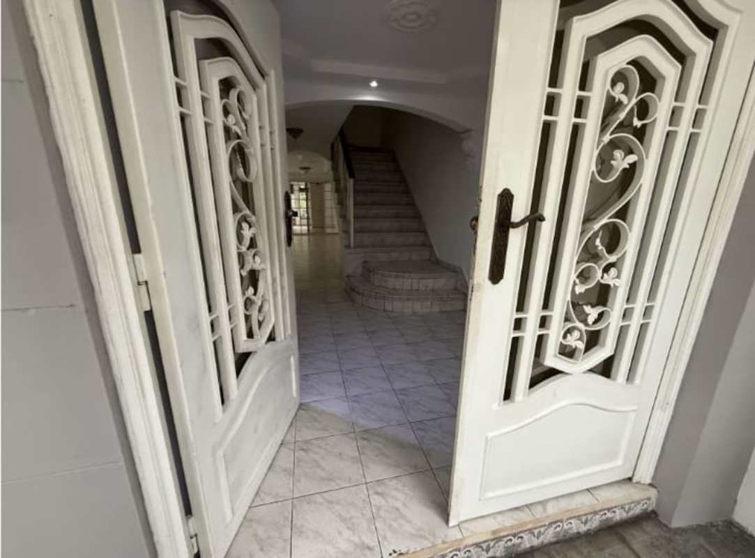 Lush fenced private garden with flowers, lawn, and patio Betania Club X House Panama