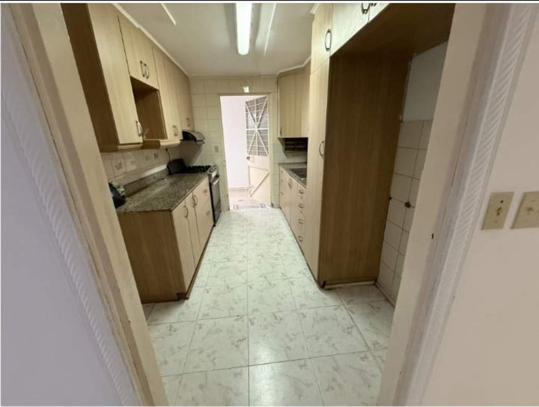 Kitchen featuring granite countertops, wooden cabinets, and appliances Club X Betania Panama City