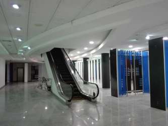 Modern spacious office with cubicles large windows commercial tower Zona Libre Colón Panama