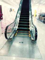 Contemporary kitchenette with stone backsplash in showroom building Zona Libre Panama