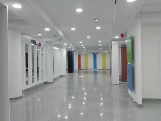 Bright escalator lobby trade zone marble floors glass railings commercial center colon Panama