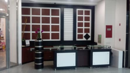 Reception area with glass desk marble floors modern design commercial building in Zona Libre Colón Panama