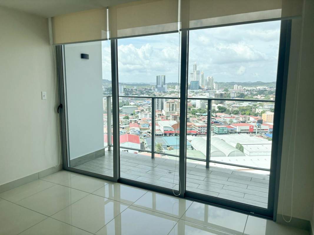 Balcony with glass railing overlooking Vía España Panama City at PH Torres del Parque apartment