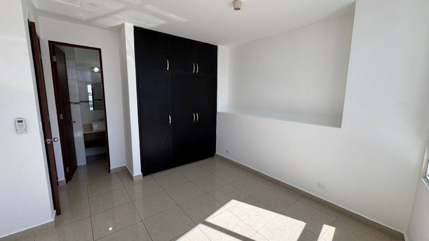 Bedroom with large window, ensuite bathroom, and built-in closet PH Elevation Tower Costa del Este