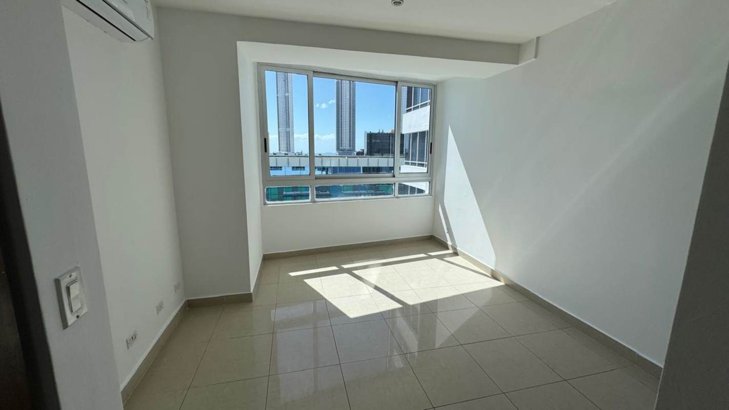 Kitchen with granite counters, double sink, white cabinetry in PH Elevation Tower Panama City