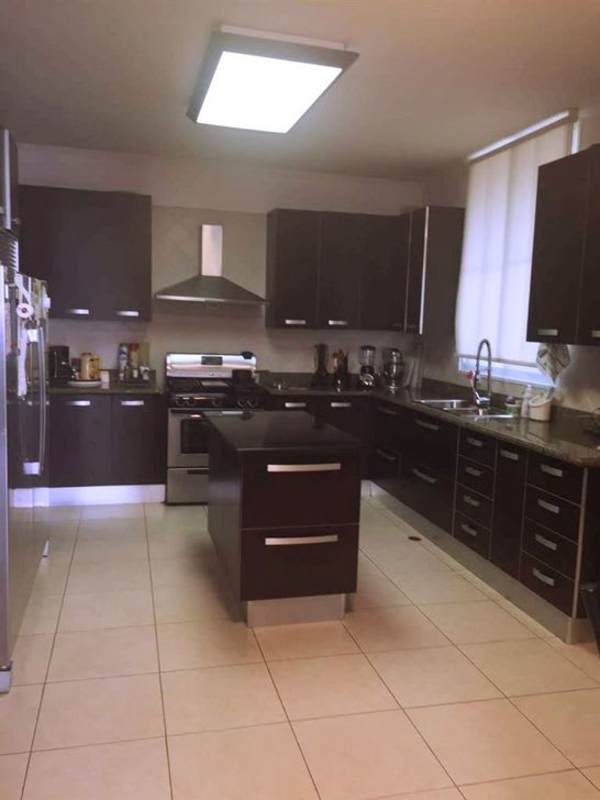 Modern kitchen with granite counters and stainless appliances in PH Costa Pacifica Punta Pacifica Panama