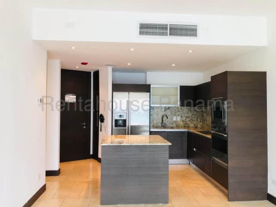 Open plan kitchen living area with large windows city and ocean view PH The Ocean Club Panama