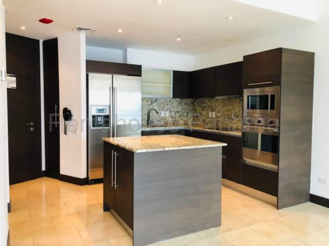 Luxury kitchen with granite island stainless appliances PH The Ocean Club Punta Pacifica Panama