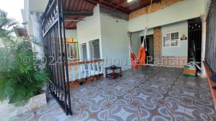 Dining room area with colorful tablecloth, stone tile accent wall Vacamonte Panama Oeste