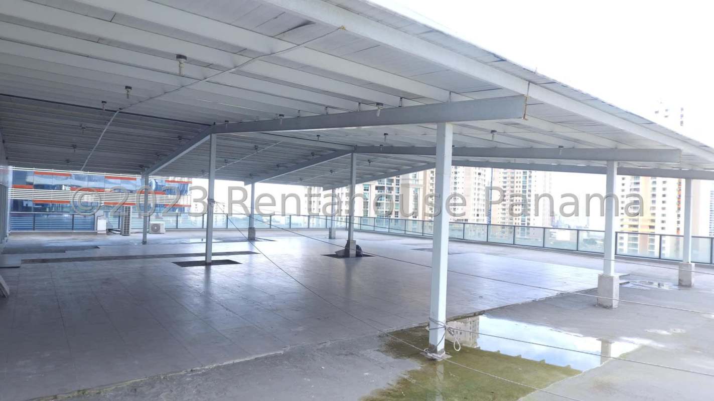 Lobby with glass doors, orange accents and large windows