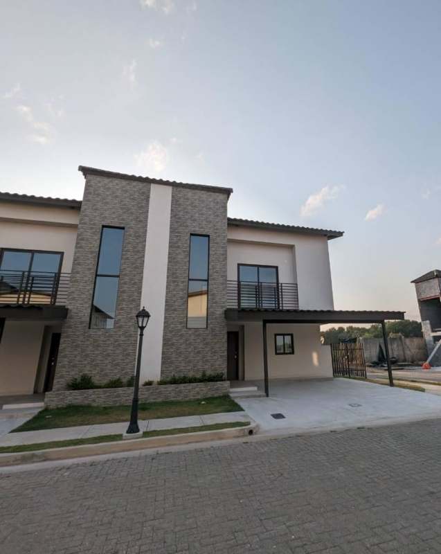 Kitchen with modern cabinetry, stainless steel appliances, and breakfast bar in Costa Linda Costa Sur Panama