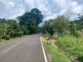 Rural asphalt road frontage to buildable lot with lush greenery Capira Panama
