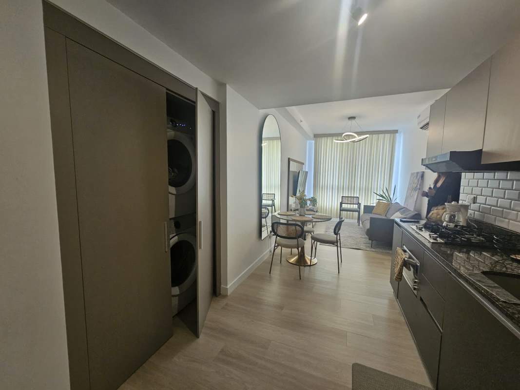 Dining area integrated with living space in luxury furnished apartment PH Quatrium Panama