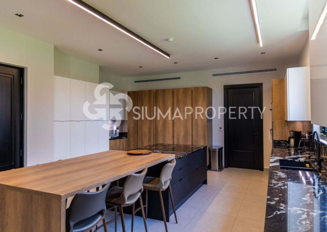 Home theater with tiered seating and projector in Santa Maria luxury mansion Panama