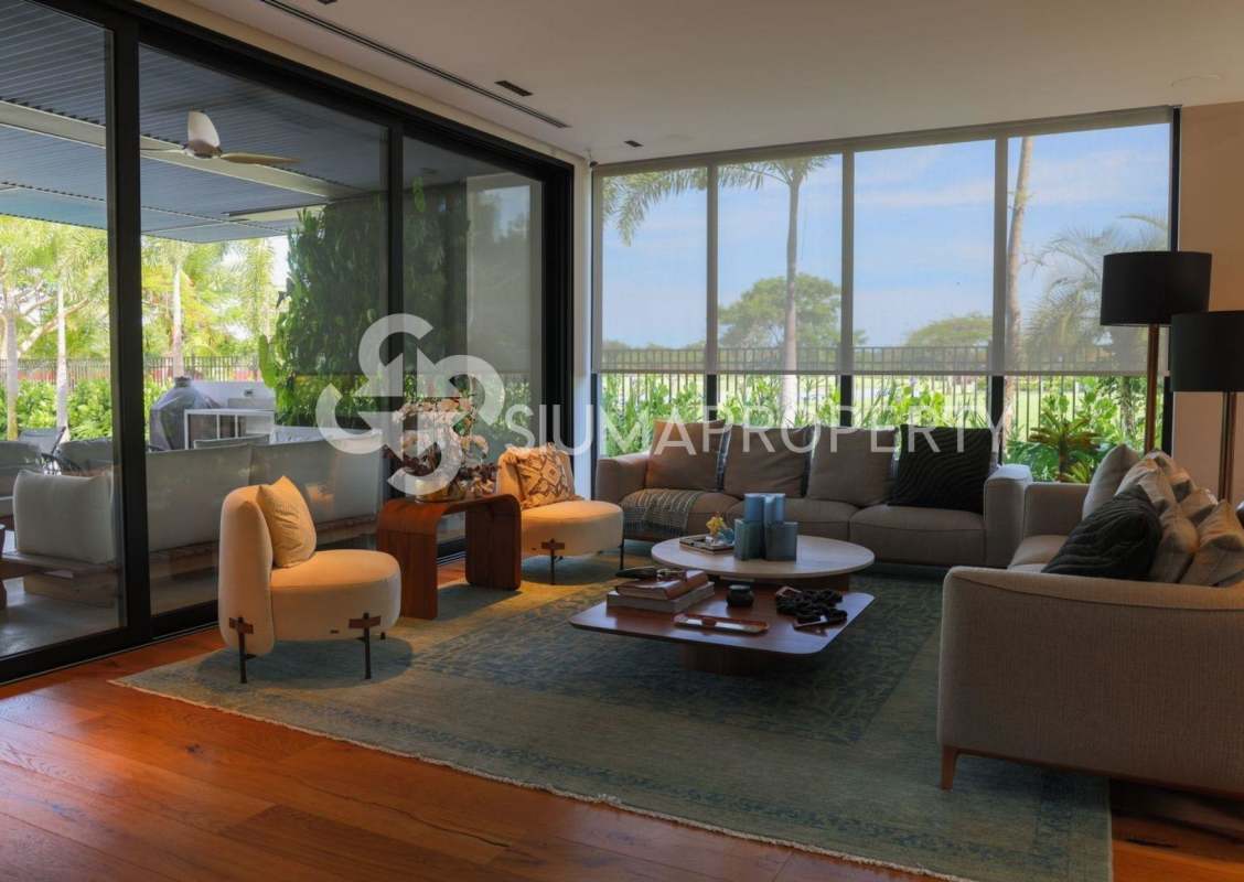 Modern kitchen with wood cabinetry and marble island in luxury estate Santa Maria Panama