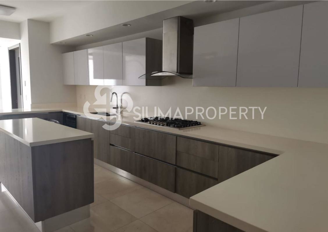 Master bedroom with large windows, golf views, ensuite bathroom at The Reserve Santa María Golf Panama City